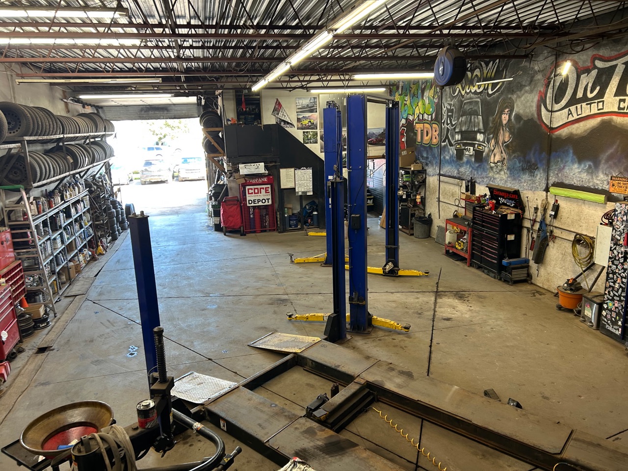 The whole shop from above, bay door open