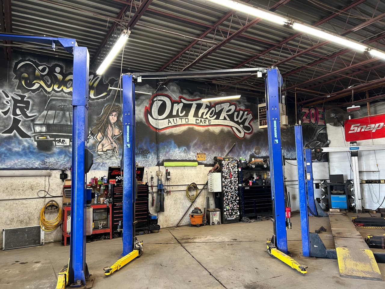 Two lifts, the mural and the toolboxes